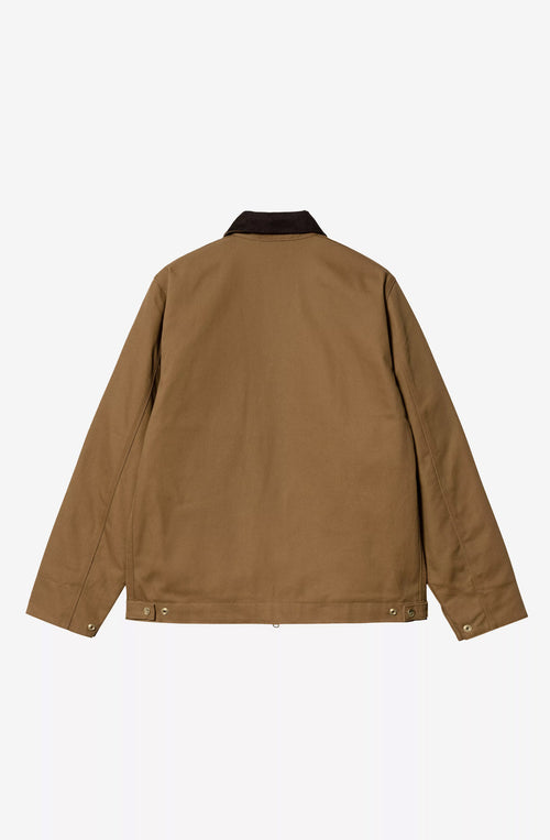 Chaqueta Carhartt WIP color Hamilton Brown con cuello de pana marrón oscuro, cierre de cremallera y bolsillos frontales.
