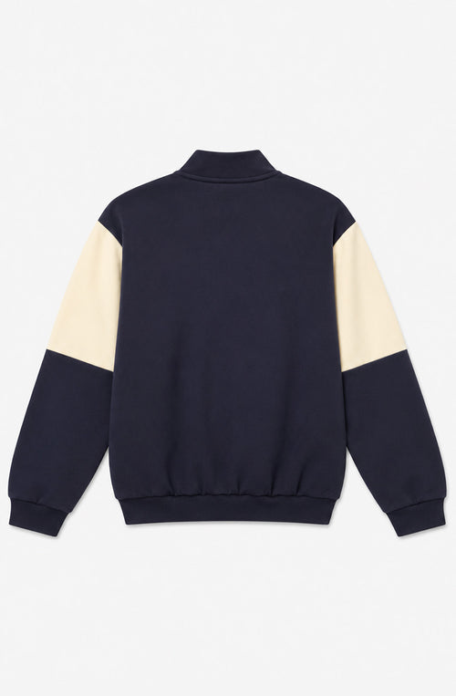 Sudadera unisex Tupoc azul marino con paneles verdes y crudos, cuello alto con media cremallera y logo Kaotiko en el pecho.