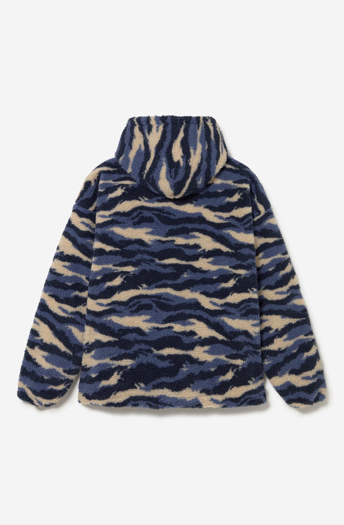 Polar Après Ski Ivory de tejido fleece con estampado abstracto azul marino, azul y marfil, capucha y media cremallera.