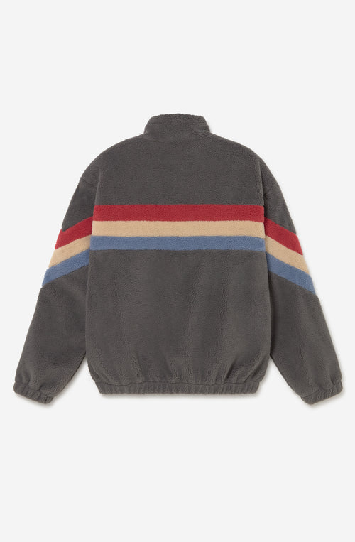 Polar Wabi Sabi Khaki de fleece con franjas rojas, beige y azules, cuello alto y cierre de cremallera.