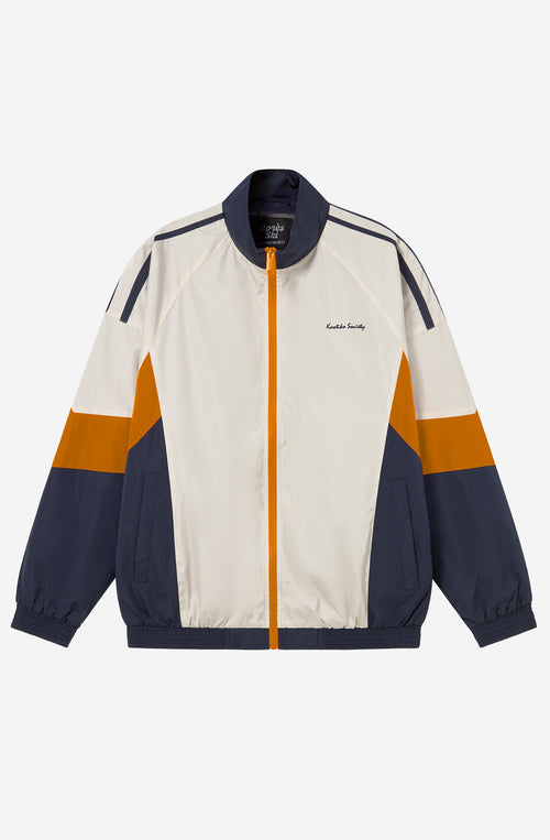 Chaqueta Retro Ski en marfil, vanilla y azul marino con diseño color block, cremallera a contraste y logo Kaotiko Society.