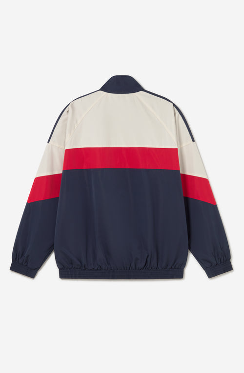 Chaqueta Retro Ski en marfil, rojo y azul marino con diseño color block, cremallera roja y logo Kaotiko Society.
