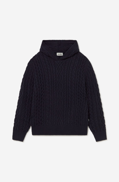 Sudadera unisex de punto trenzado azul marino con capucha y fit relajado de inspiración après ski.