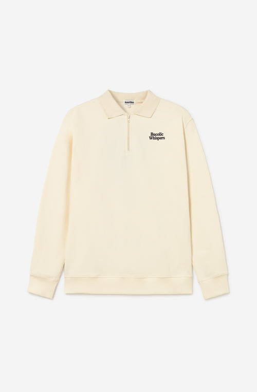 Sudadera zipper ivory con cuello polo, logo Bucolic Whispers en el pecho y bordado floral en la espalda.